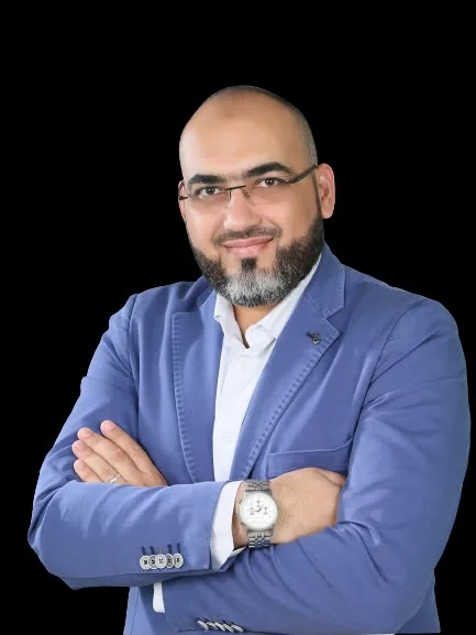 Portrait of Dr. Mohammad Abu-Sheikha in a blue jacket
